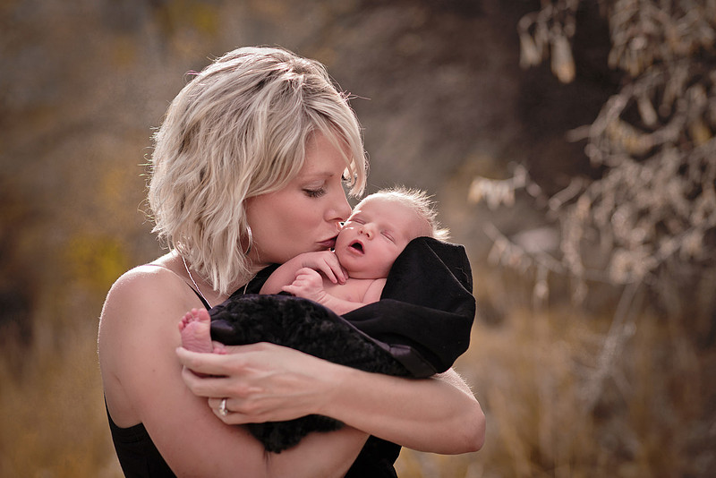 newborn baby mother kiss love